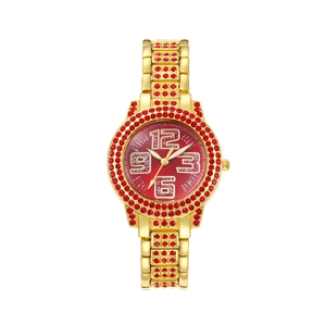 Macro detail of luxury gold quartz watch featuring red rhinestones and big numerals