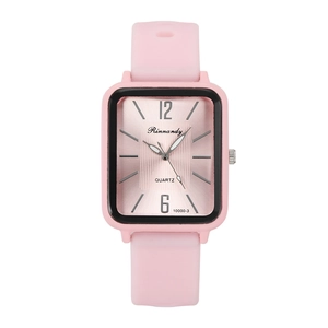 Detail of pink rectangular quartz watch with jelly silicone strap and radial dial texture