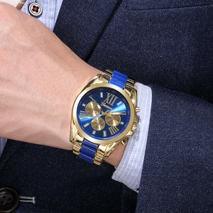 Close-up of Geneva men's watch with blue sunray dial and gold metal resin strap