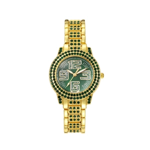 Detail view of a luxury gold watch with emerald green stones and diamond numeral markers