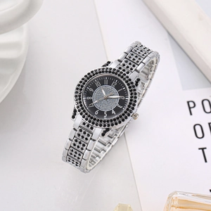 Women's quartz watch with silver metal band and rhinestones on black glitter dial