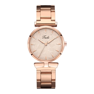 Detail of rose gold ladies watch with unique leaf texture dial and metal link bracelet