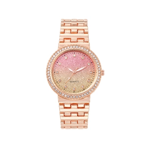Women's rose gold watch with sparkling gradient dial and crystal-encrusted bezel