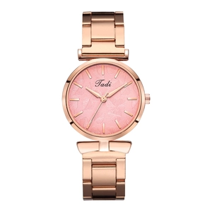 Detail view of rose gold mesh strap watch with elegant pink leaf pattern dial and Tadi logo