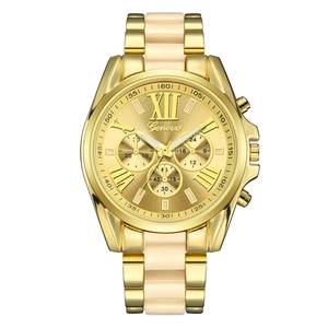 Close-up of Geneva gold-tone steel watch with Roman numerals and cream resin link band