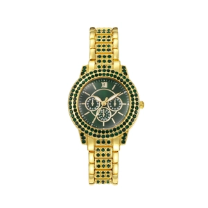 Détail d'une montre dorée avec cadran vert, chiffres romains et lunette sertie