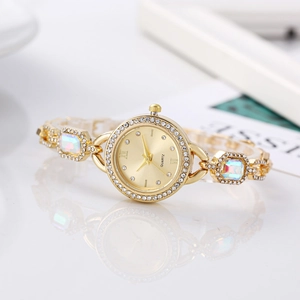 Luxury gold quartz watch for women with colorful crystals and sparkling diamonds