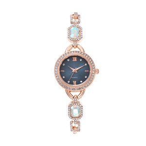 Women's rose gold quartz watch with diamond bezel and iridescent faceted gemstones