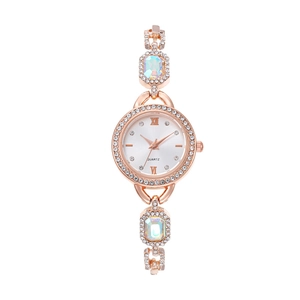 Elegant rose gold women's quartz watch with colorful crystals and sparkling diamond bezel