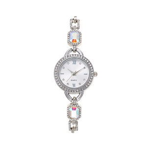 Detailed macro view of the silver quartz watch dial with encrusted crystals and gemstones