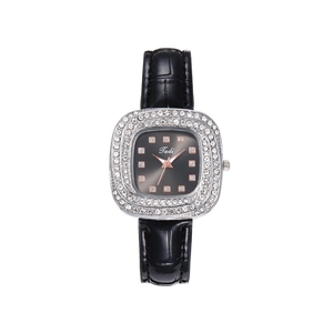 Detailed macro of a women's square quartz watch with diamond-set bezel and leather strap