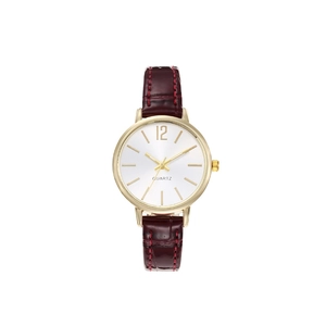 Detail of classic women's quartz watch with burgundy croc leather strap and gold case