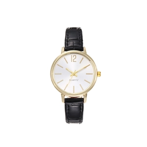 Macro detail of gold-cased quartz watch with black crocodile-patterned leather strap