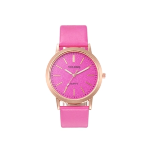 Detailed close-up of rose gold watch case with pink leather strap and purple dial