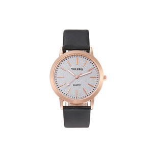 Detail of rose gold quartz watch with silver glitter dial and black leather strap