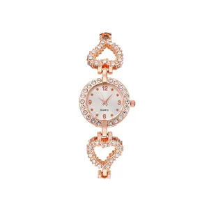 Rose gold quartz watch for women with round crystal bezel and heart link bracelet
