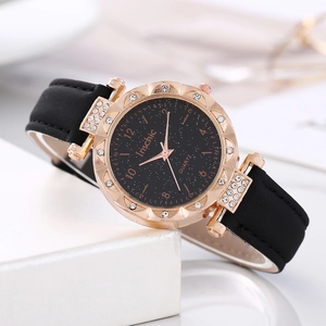 Montre à quartz élégante pour femme avec cadran noir étoilé et boîtier or rose strass