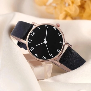 Minimalist women's quartz watch with black dial, rose gold case and leather strap