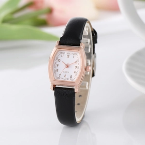 Vintage tonneau rose gold watch with black leather strap and white dial for women