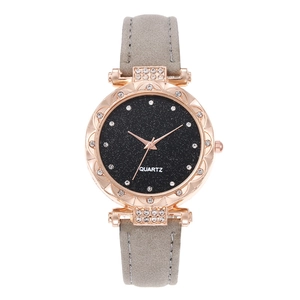 Detail of rose gold alloy watch case with starry dial and minimalist diamond bezel