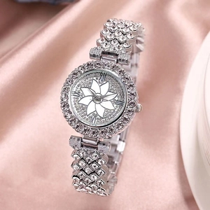 Fashion silver women's watch with rhinestone floral dial on pink silk background
