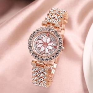 Luxury rose gold women's watch featuring a crystal-set bezel and floral dial detail