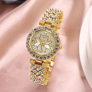 Fashionable gold rhinestone women's watch with flower dial on pink silk background
