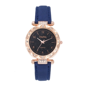 Montre à quartz étoilée pour femme avec boîtier or rose strass et bracelet en cuir bleu