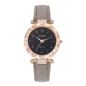 Montre quartz femme avec cadran ciel étoilé, boîtier strass or rose et bracelet gris