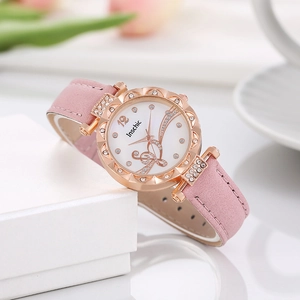 Women's quartz watch with rose gold rhinestone case and floral dial on pink leather strap