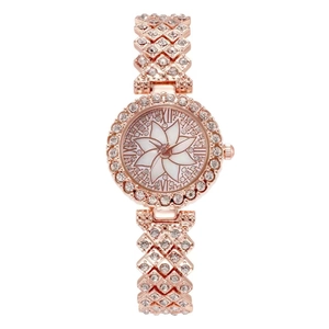 Women's rose gold rhinestone flower watch with a luxury diamond-studded strap