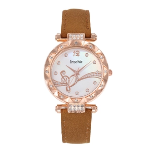 Women's quartz watch with rose gold rhinestone case and brown leather strap with notes