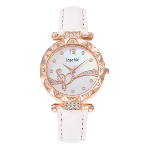 Detail of rose gold watch case with wavy diamond-encrusted bezel and musical note dial