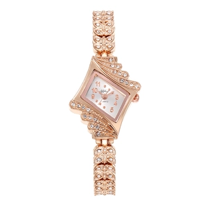 Montre à quartz élégante en or rose pour femme avec strass et bracelet en forme de feuille