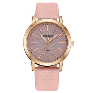 Detail of rose gold case and pink leather strap on a minimalist quartz lady watch