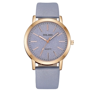 Detailed macro view of the rose gold case and purple frosted dial of this quartz watch