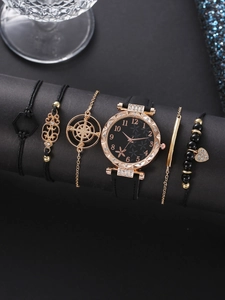 Close-up of black and rose gold 6-piece watch and bracelet set on a luxury display stand