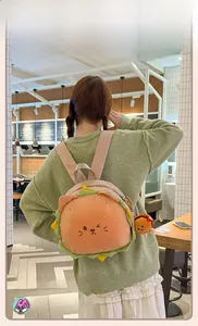 Detail of cute cat burger plush backpack with creative lettuce and cheese fabric layers