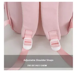 Close-up of adjustable pink shoulder straps with white plastic buckles on school backpack
