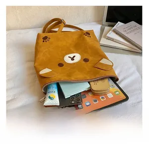 Interior view of the ginger yellow bear tote bag showing large capacity for tablet and cosmetics
