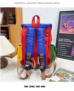 Detail showing the colorful patchwork design and durable nylon fabric of the hiking backpack