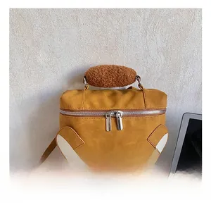 Detail of thickened plush handle and dual zippers on cartoon bear backpack
