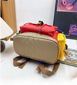 Detailed bottom view of large capacity kids hiking backpack with colorful patchwork design