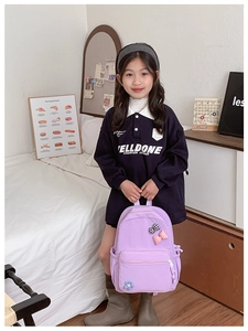 Close-up of lilac floral school backpack with cute bow details and multiple pockets