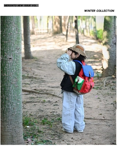 Outdoor kids hiking backpack with vibrant color blocking and leather buckle detail