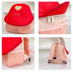 Detail view of fruit-style kid backpack showing zippers, mesh pockets and back system