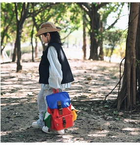 Close-up of kids outdoor colorful hiking backpack with buckle straps in nature