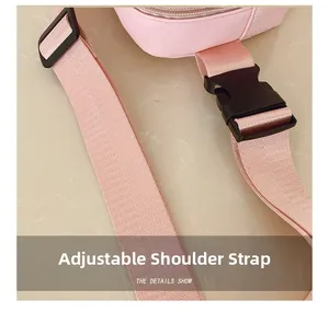 Close-up of pink nylon shoulder strap with adjustable buckle and plastic buckle detail