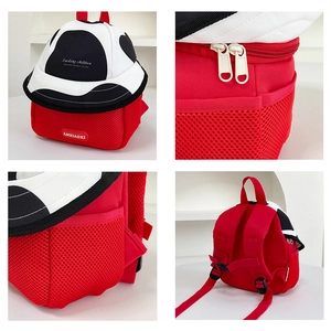 Detail view of red kids backpack with cow print lid and ergonomic non-slip straps