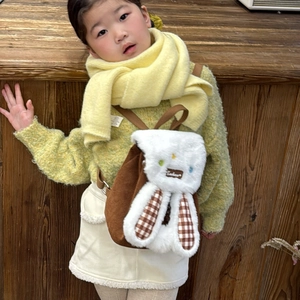 Cute brown corduroy toddler backpack featuring white plush bunny ears and drawstring